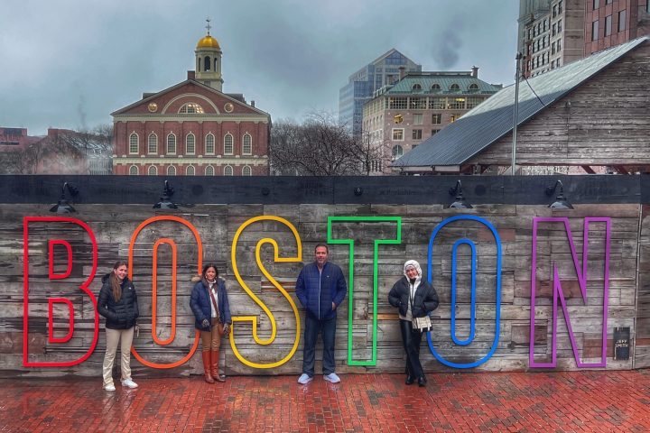 a group of people standing in front of a building