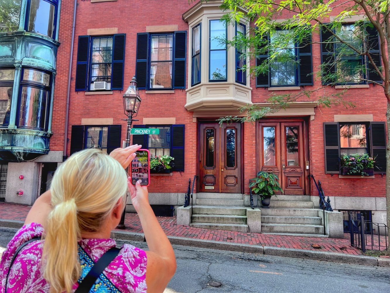 a woman standing in front of a building