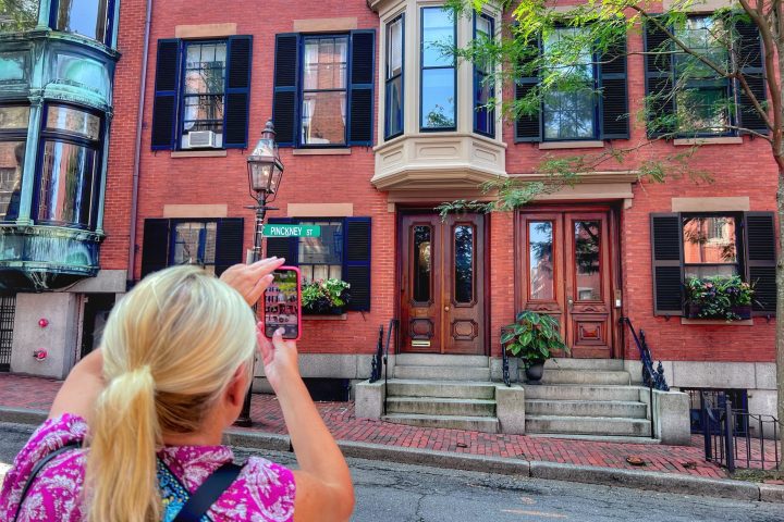 a woman standing in front of a building