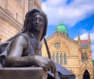 a statue in front of a building