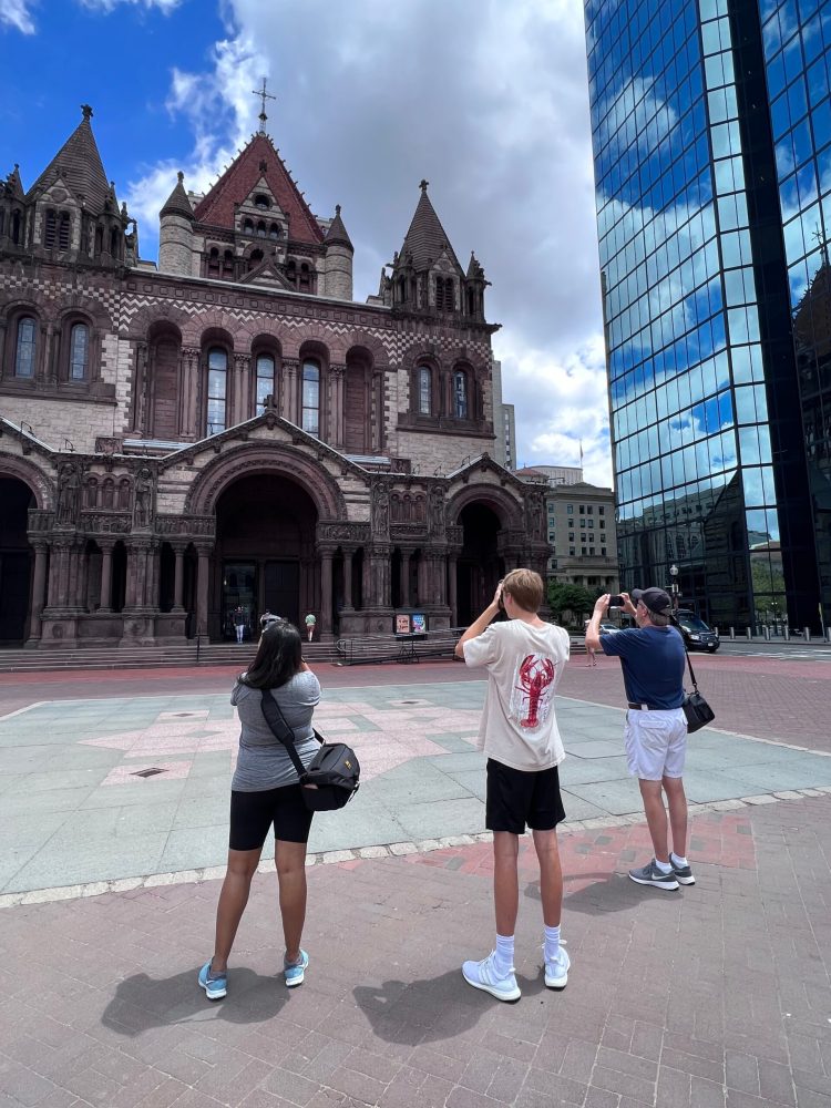 a group of people standing in front of a building