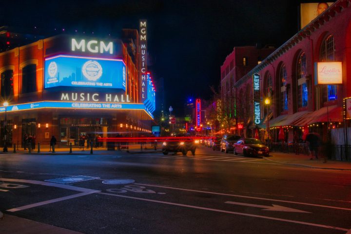 a lit up city street at night